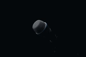 Image of a microphone against a dark backdrop